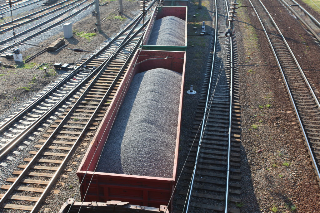 railroad tracks. wagons carrying cargo